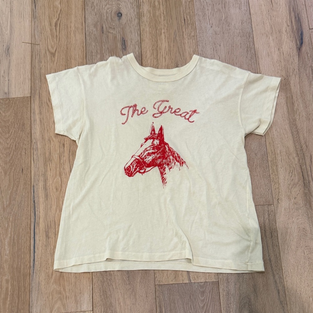 THE GREAT. Cream Tee with Red Horse Graphic
